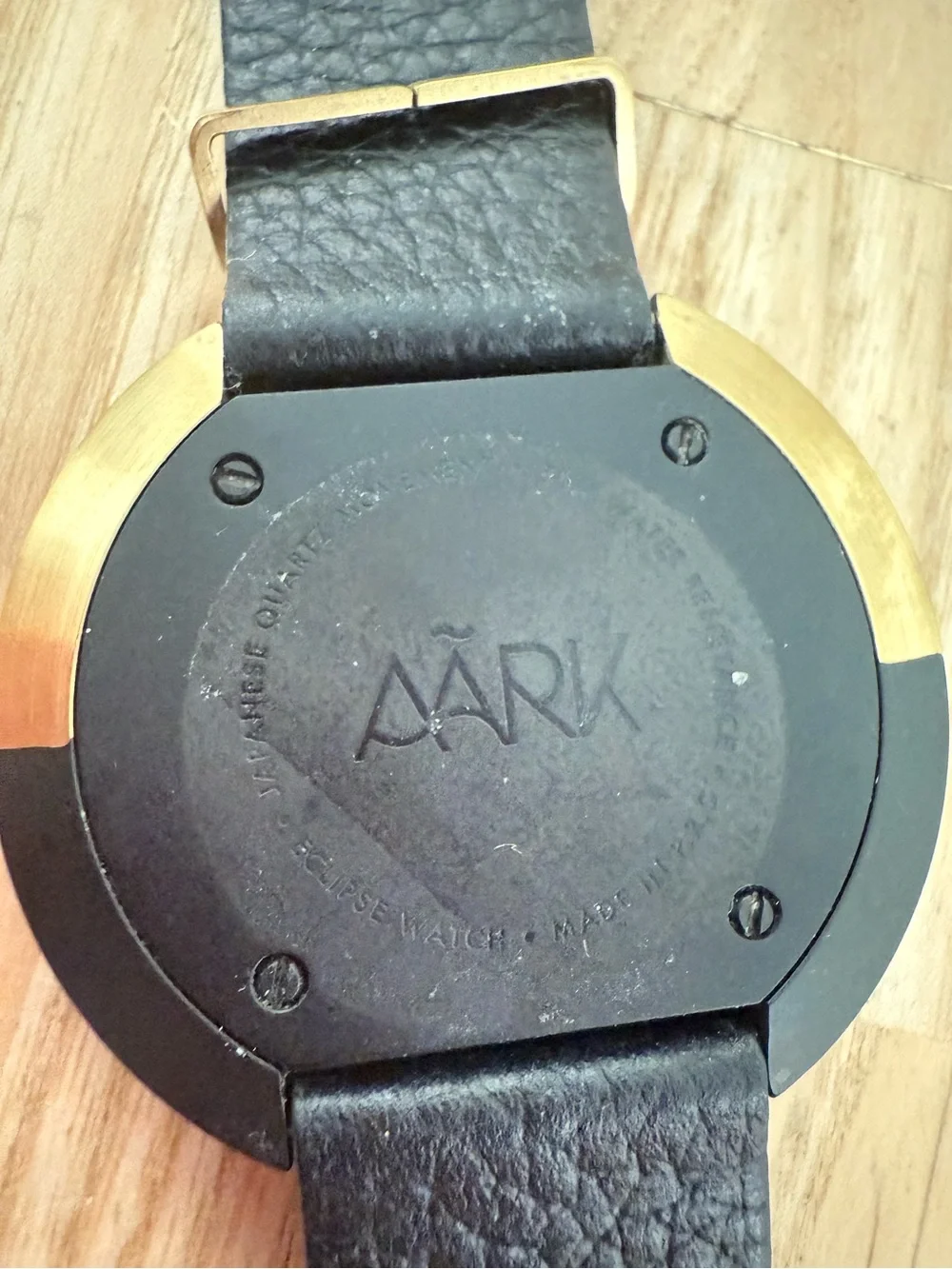 AARK eclipse gold tone and black leather minimalist watch NEW BATTERY